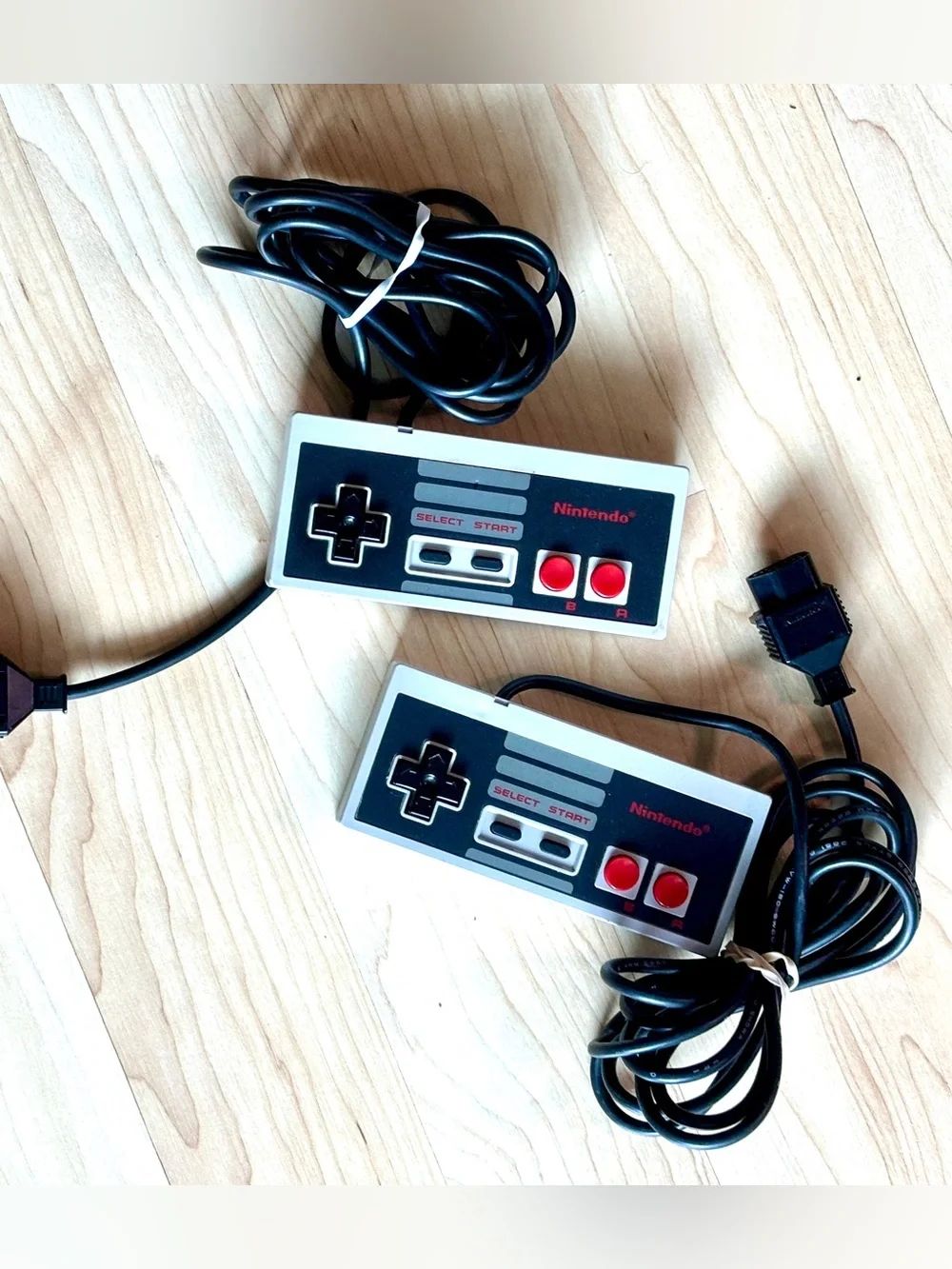 Nintendo Entertainment System (NES) controller, model NES-004. Set of two.